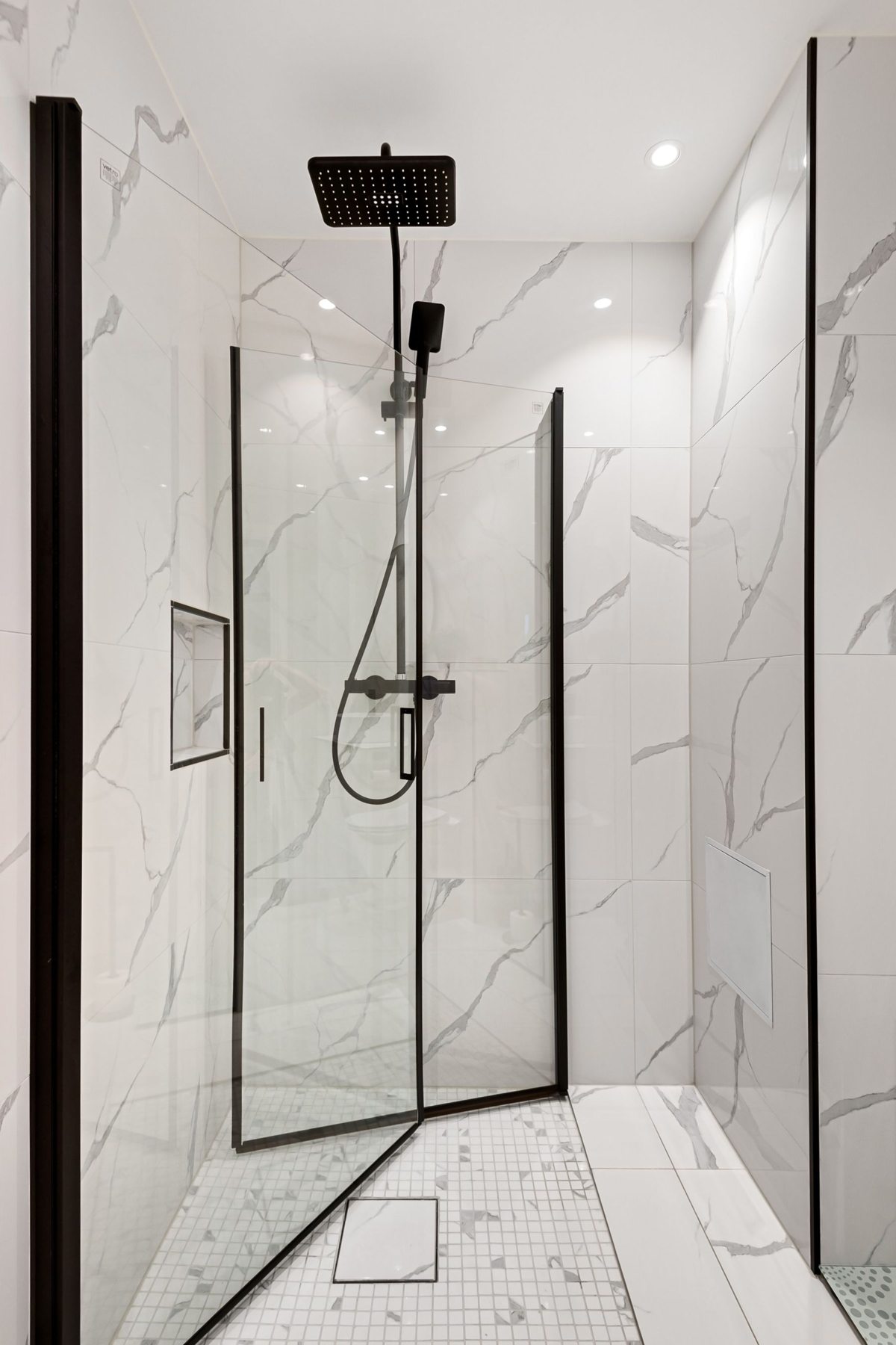 Bright bathroom with a glass enclosed walk-in shower